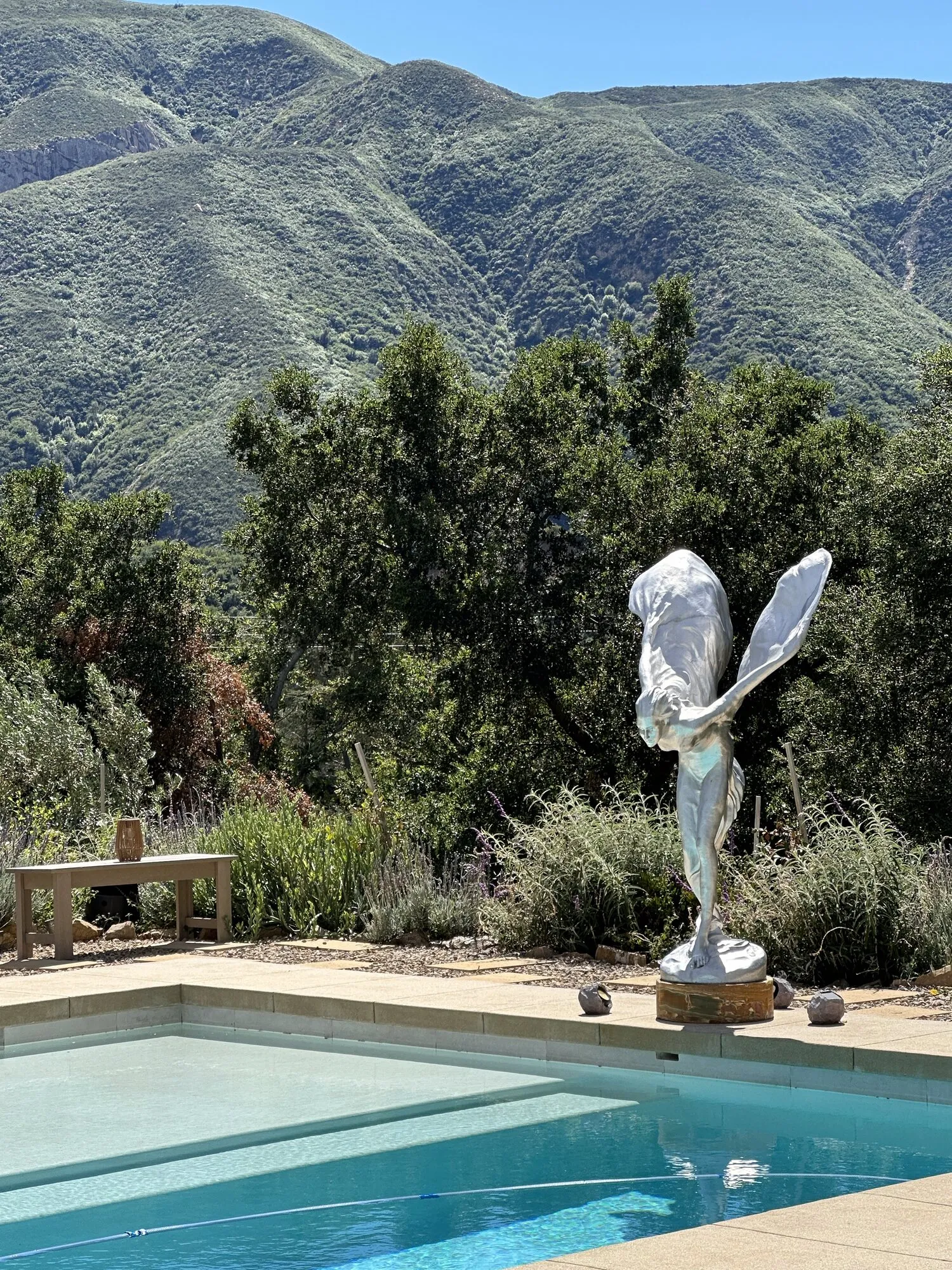 Poolside with mountains in the background