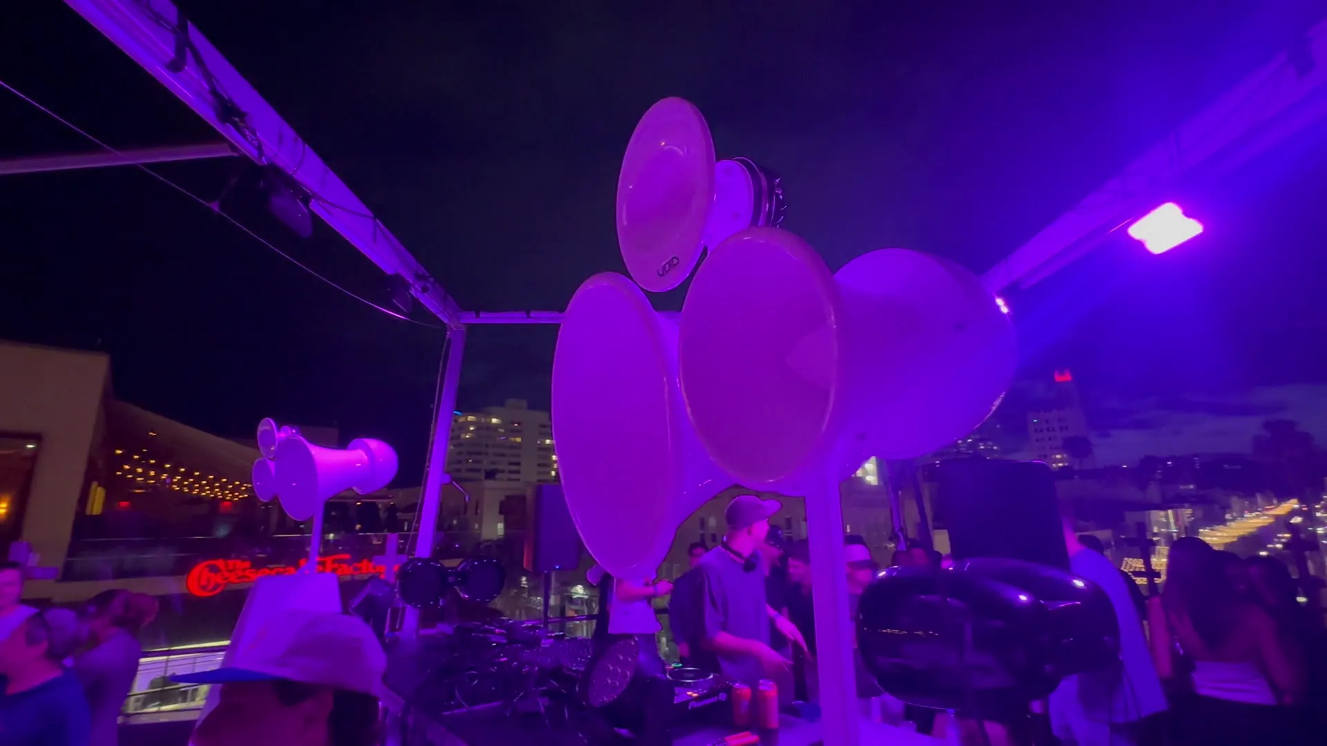 Rooftop party lit purple with Void Air Motion speakers